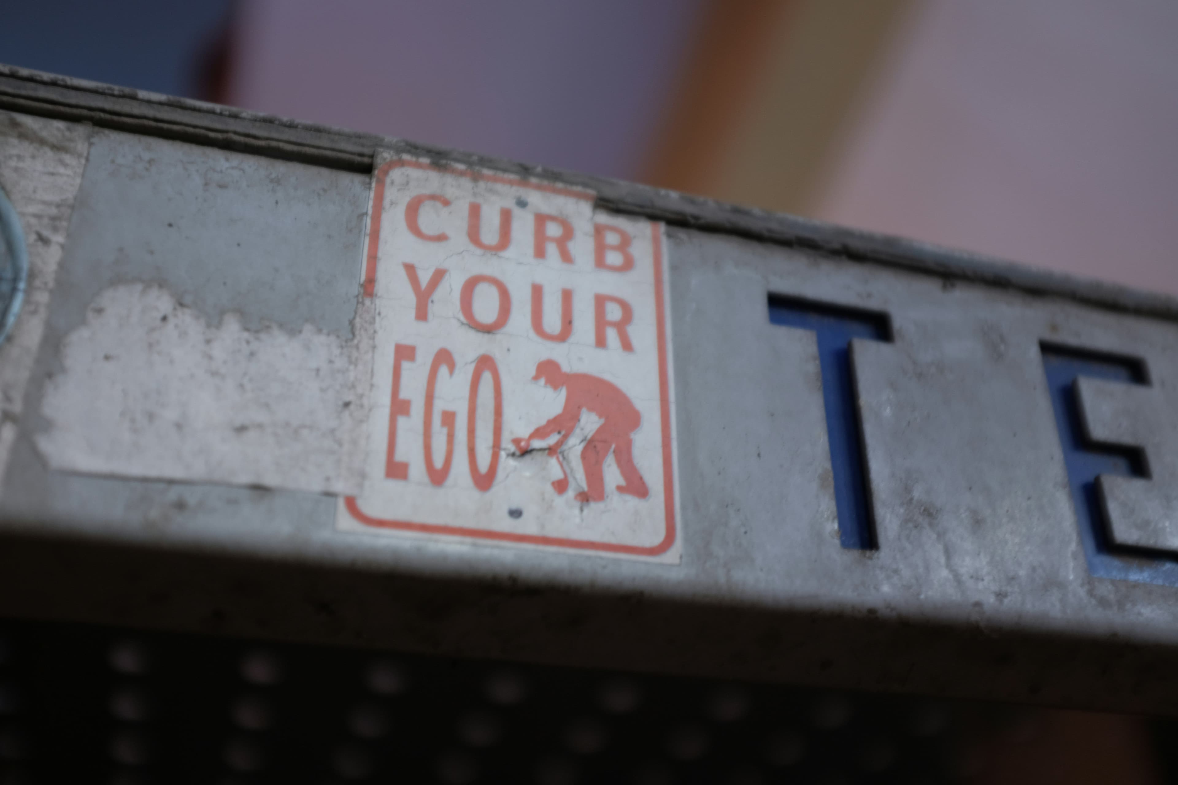 Curb Your Ego Sticker Art. Owned photo Orkun Azap by Unsplash